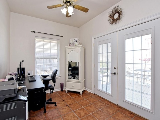 tiled home office featuring french doors and ceiling fan