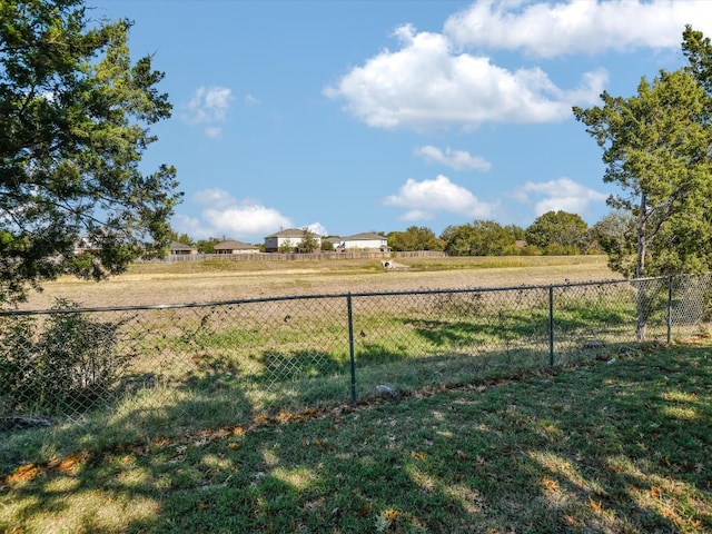 view of yard with a rural view