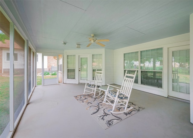 sunroom / solarium featuring ceiling fan