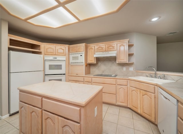 kitchen featuring light brown cabinetry, tasteful backsplash, white appliances, sink, and tile countertops