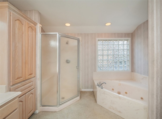 bathroom with vanity and independent shower and bath