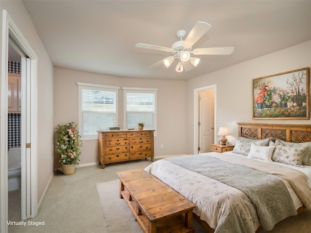 bedroom with ceiling fan and light carpet