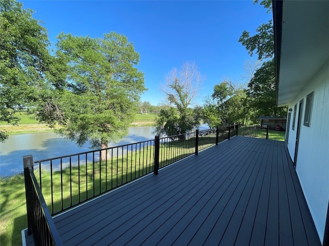 wooden deck featuring a water view