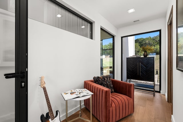 sitting room featuring hardwood / wood-style floors