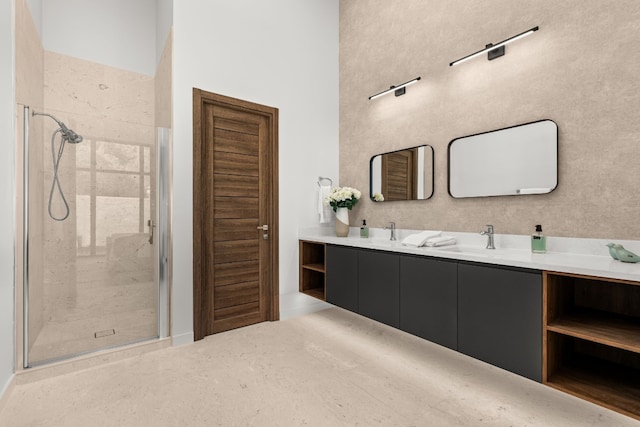 bathroom with a high ceiling, vanity, and a shower with door