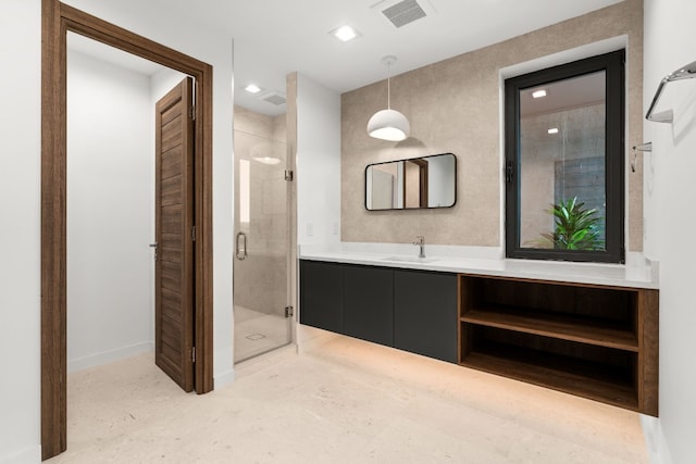 bathroom with vanity and walk in shower