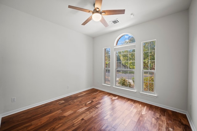 spare room with wood-type flooring and ceiling fan