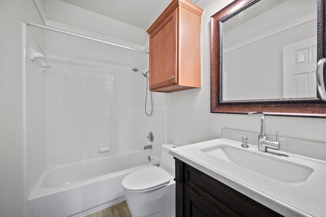 full bathroom featuring vanity, tiled shower / bath combo, and toilet