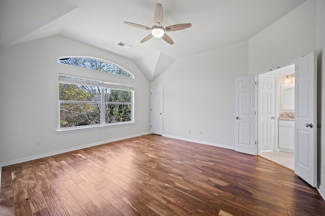 interior space featuring ceiling fan, dark hardwood / wood-style flooring, and lofted ceiling