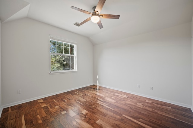 unfurnished room with ceiling fan, dark wood-type flooring, and vaulted ceiling