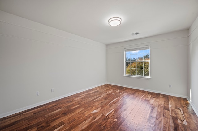 empty room with hardwood / wood-style floors