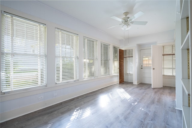 unfurnished bedroom with hardwood / wood-style floors and ceiling fan