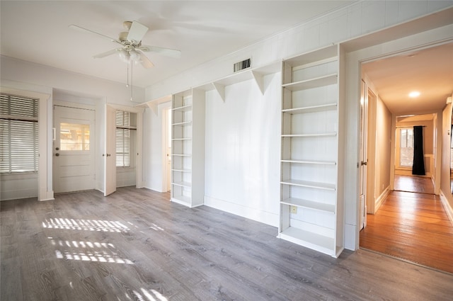 unfurnished bedroom with hardwood / wood-style floors and ceiling fan