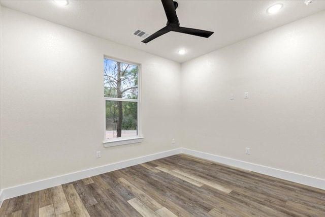 spare room with hardwood / wood-style flooring