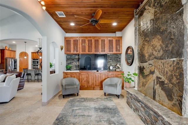 living room featuring light tile patterned floors, wooden ceiling, and ceiling fan