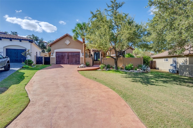 mediterranean / spanish house with a front yard and a garage