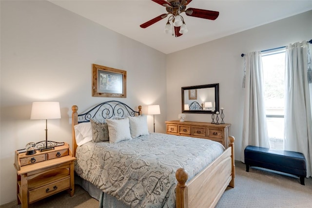 bedroom featuring light carpet and ceiling fan