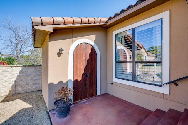 doorway to property with a patio