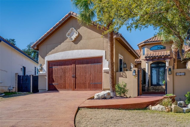 mediterranean / spanish house featuring a garage