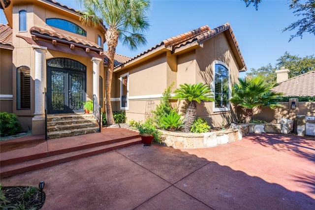 exterior space with a patio area and french doors