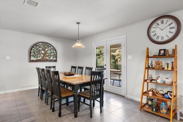 tiled dining space with french doors