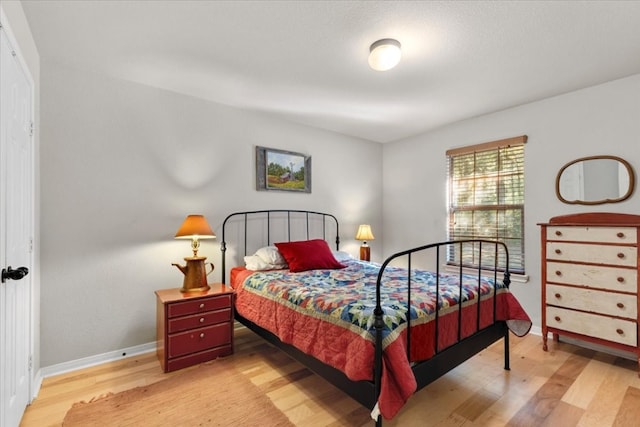 bedroom with light hardwood / wood-style floors