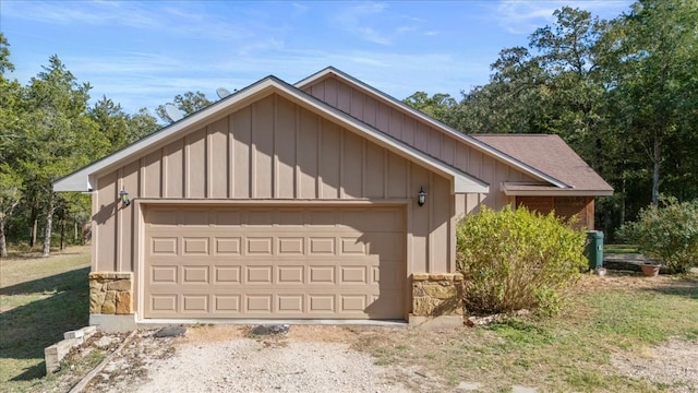 exterior space with a garage and an outdoor structure