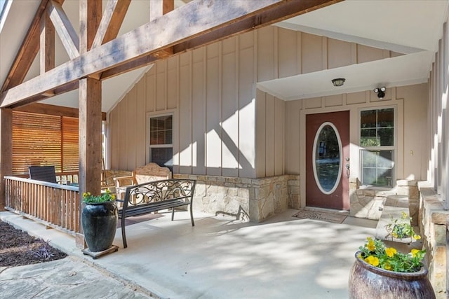 doorway to property featuring covered porch