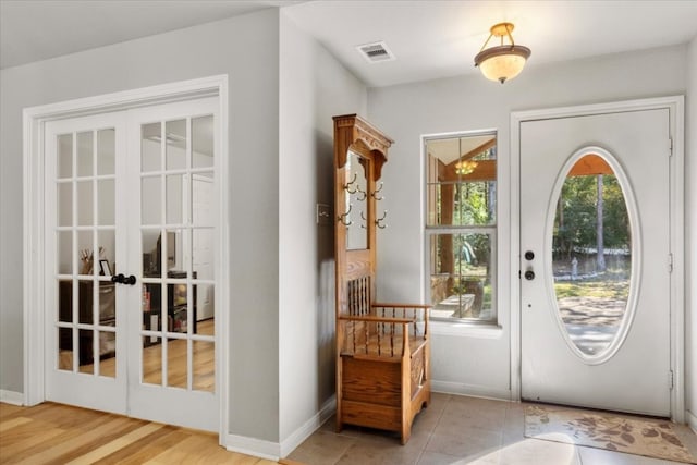 doorway to outside with french doors and light hardwood / wood-style floors