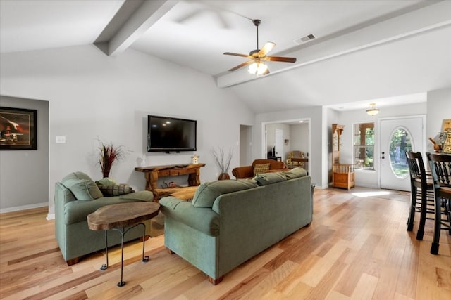 living room with vaulted ceiling with beams, ceiling fan, and light hardwood / wood-style floors