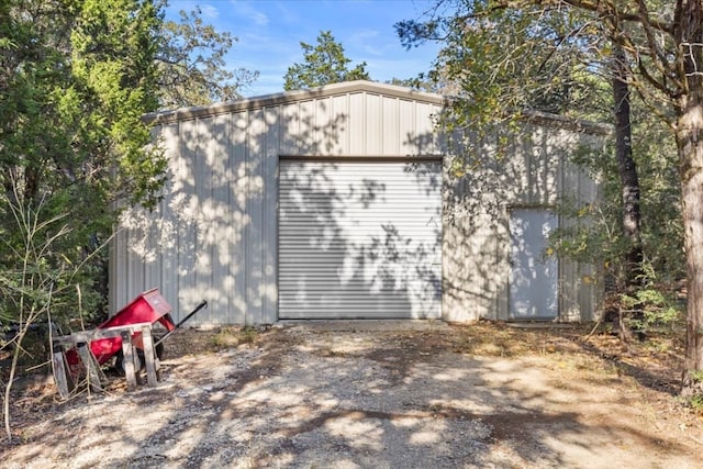 view of home's exterior featuring an outbuilding and a garage