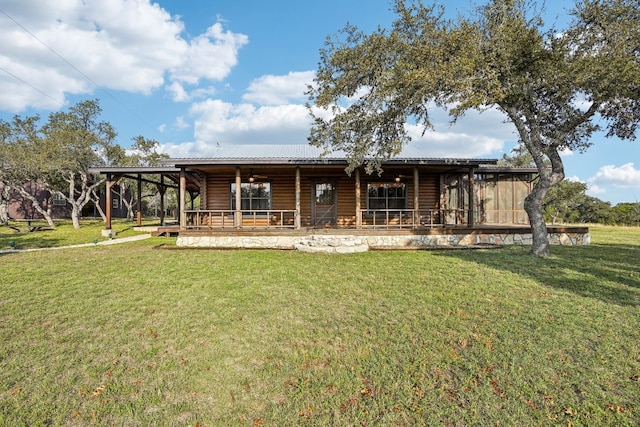 back of house with a yard