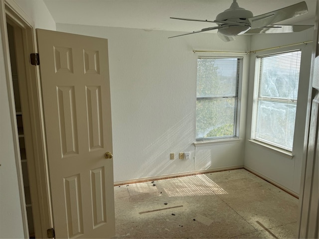 spare room with ceiling fan