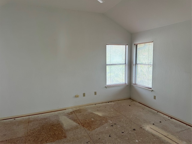 empty room with vaulted ceiling