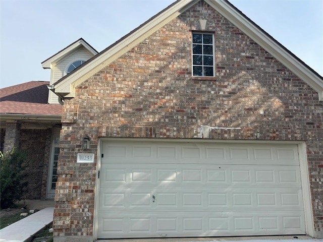 view of side of property with a garage