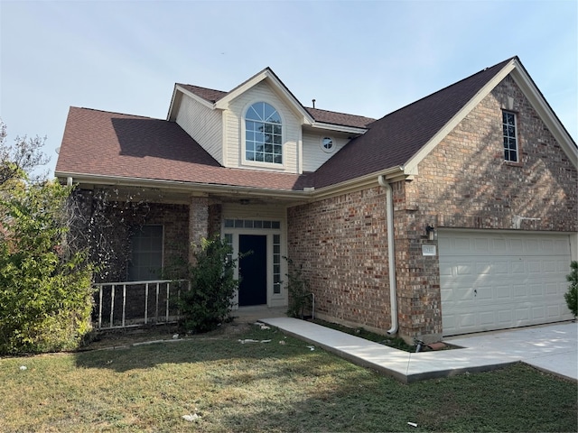 view of front of home featuring a garage and a front lawn