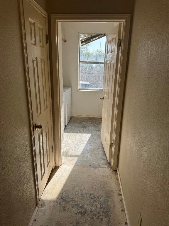 hallway featuring separate washer and dryer