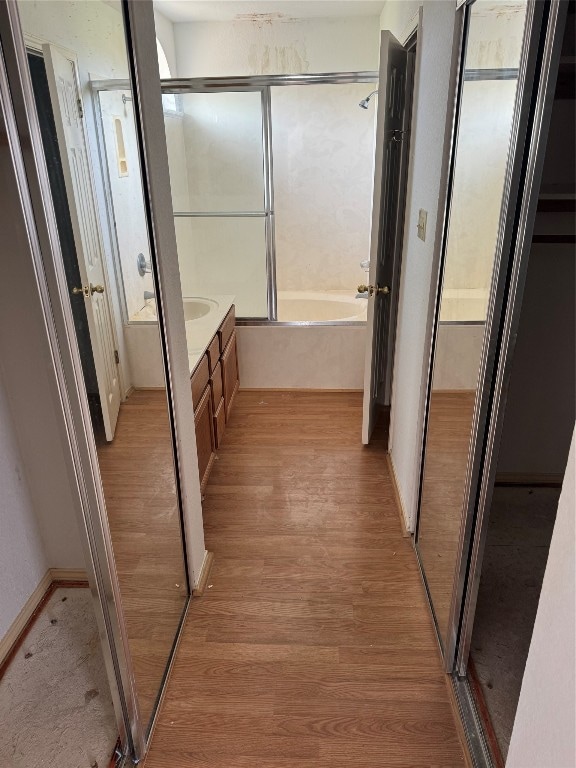 bathroom with vanity and hardwood / wood-style flooring