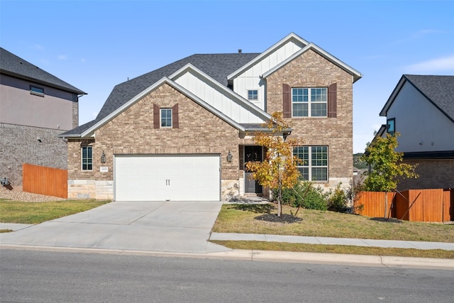 view of front of house featuring a front lawn and a garage