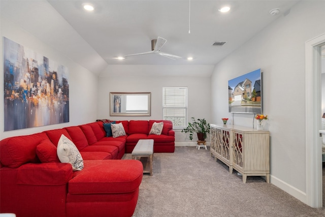 carpeted living room featuring ceiling fan and lofted ceiling