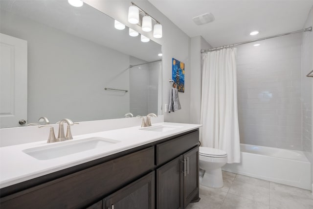 full bathroom featuring tile patterned floors, vanity, shower / tub combo, and toilet