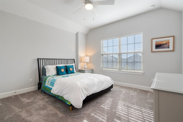 carpeted bedroom with ceiling fan and lofted ceiling