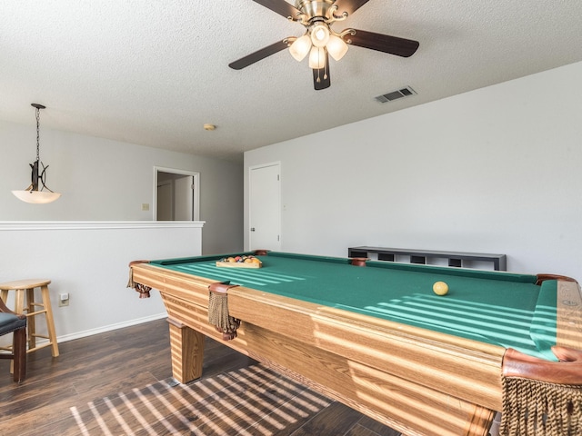 game room with dark hardwood / wood-style floors, a textured ceiling, ceiling fan, and billiards