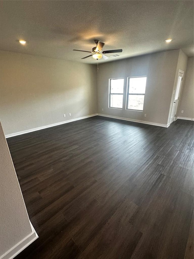 unfurnished living room with baseboards, recessed lighting, a textured ceiling, a ceiling fan, and dark wood-style flooring