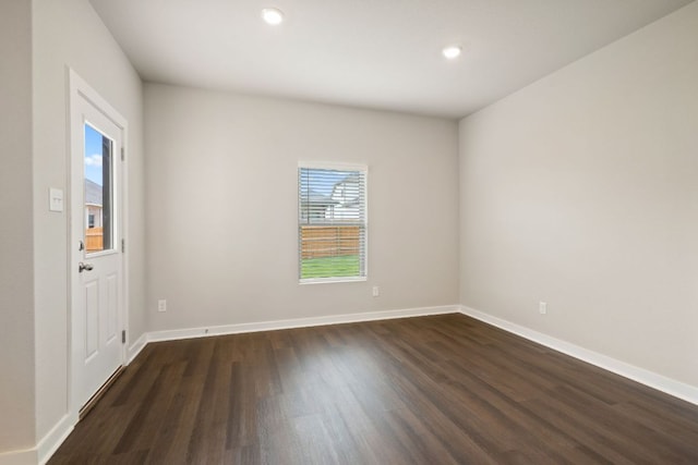 260 Lazy Lizzy Rd, Jarrell, TX 76537 - spare room with dark wood-style floors, recessed lighting, and baseboards