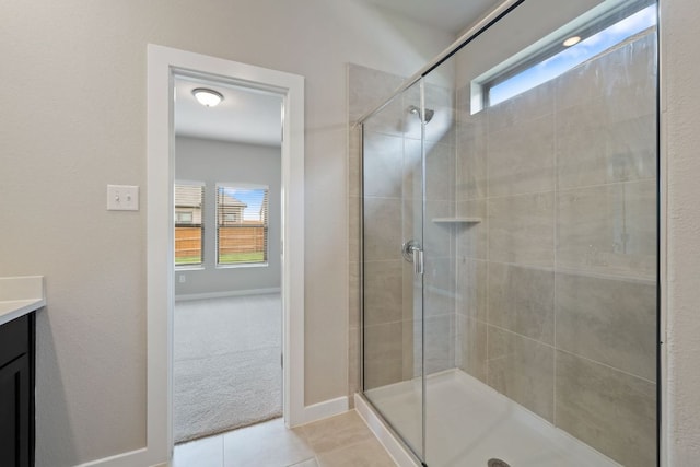 260 Lazy Lizzy Rd, Jarrell, TX 76537 - bathroom featuring a shower stall, vanity, tile patterned flooring, and baseboards