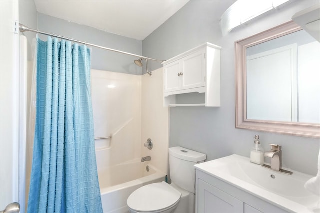 full bathroom with vanity, shower / bath combo, and toilet