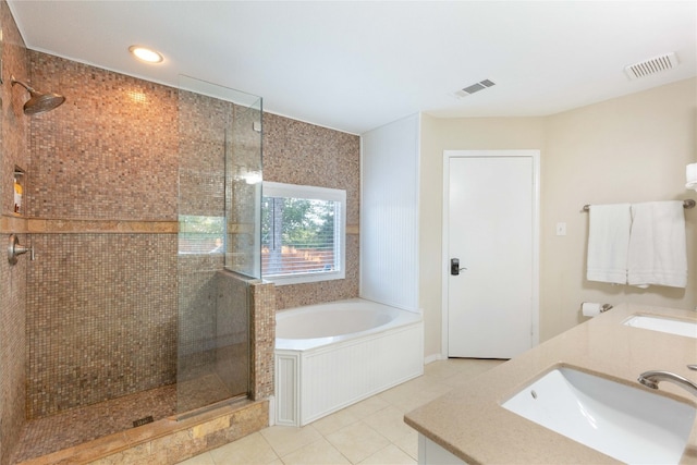 bathroom with tile patterned flooring, vanity, and independent shower and bath