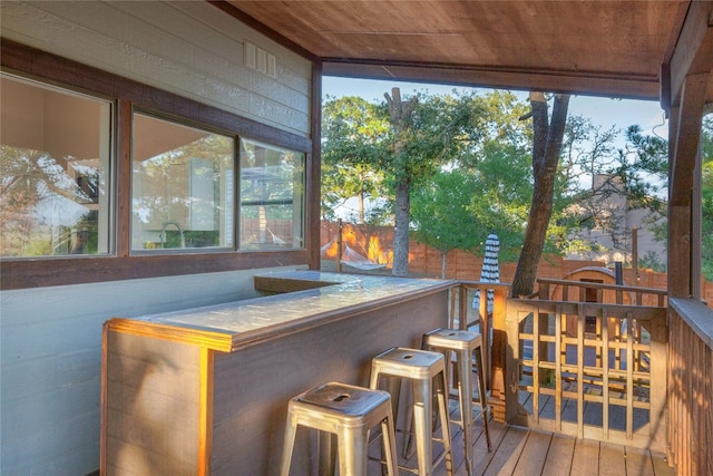 sunroom featuring wood ceiling