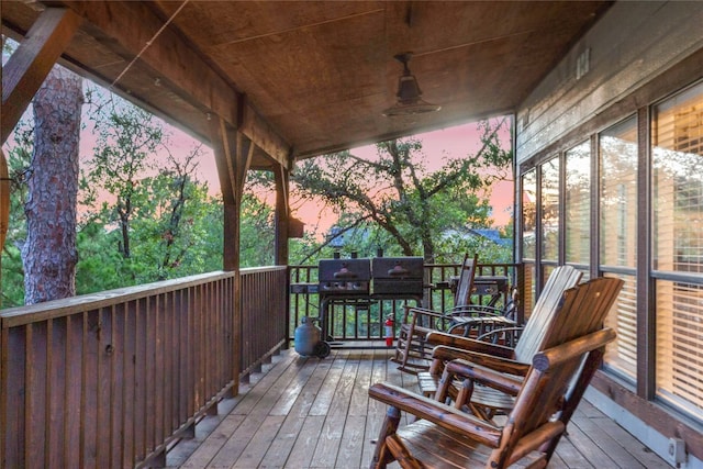 deck at dusk with ceiling fan